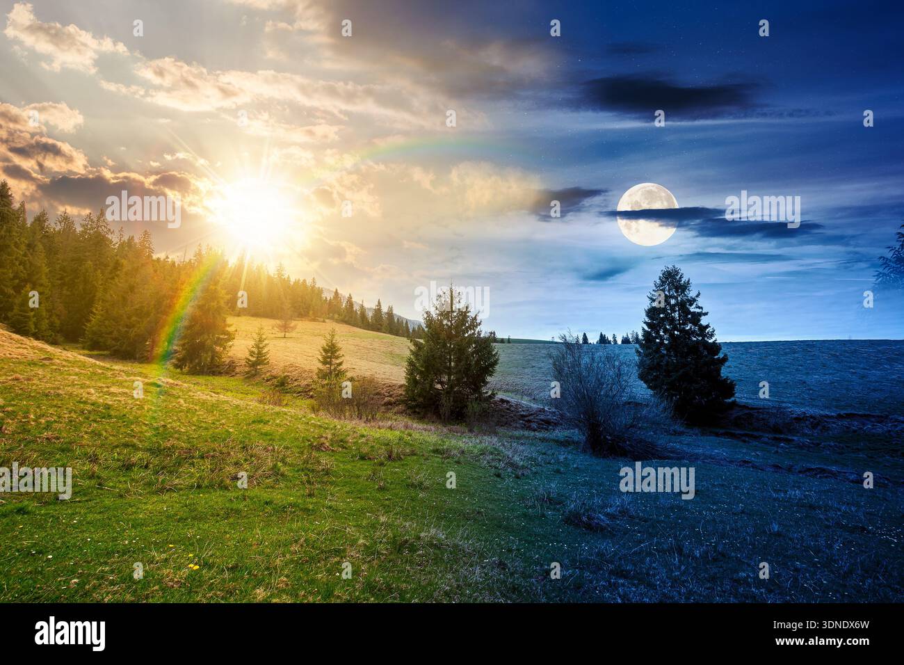 rolling hill with green field under cloudy sky in spring. day and night time change concept. scenic view countryside landscape in mountains with sun a Stock Photo
