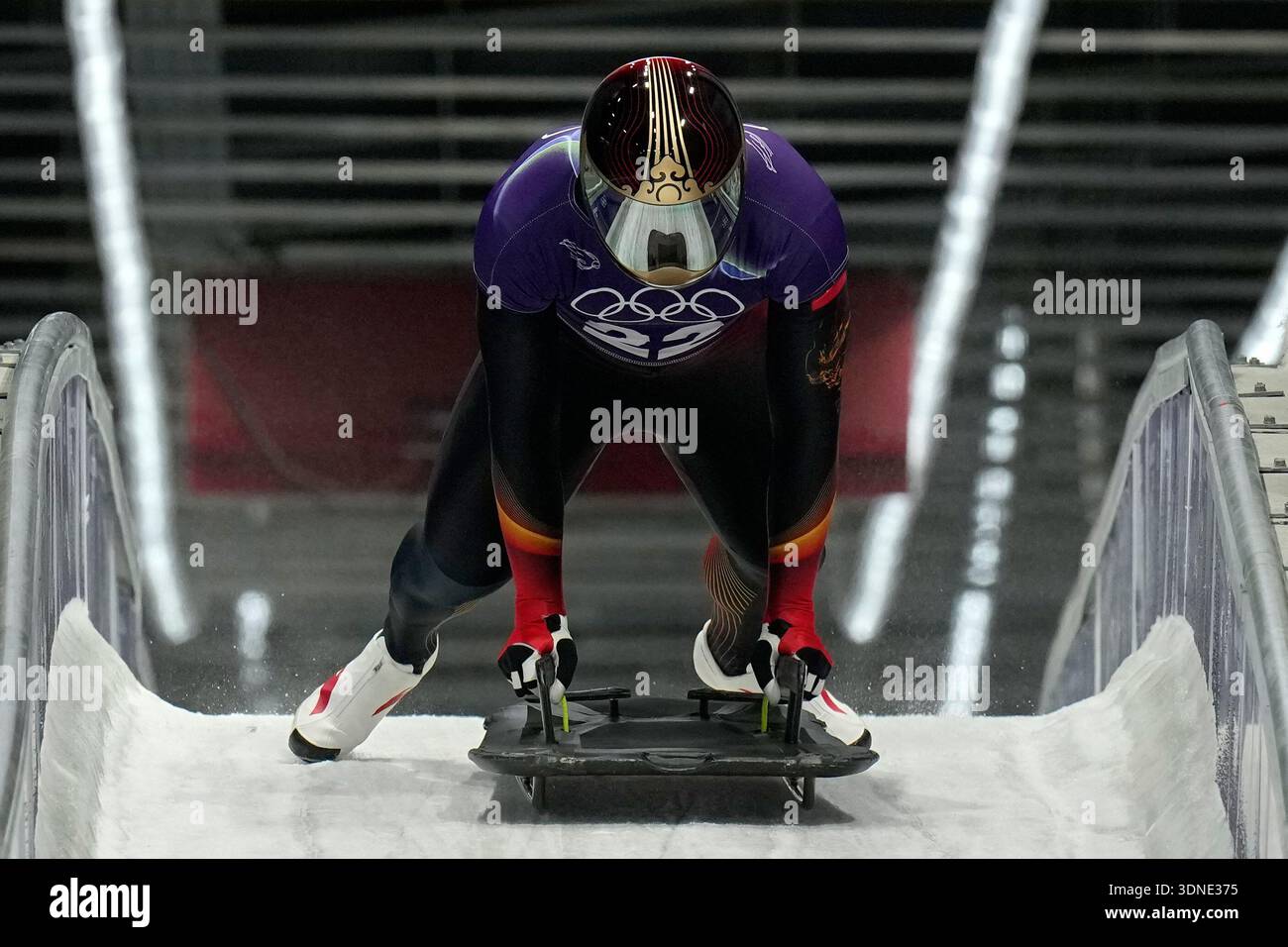 China's Chen Wenhao arrives at the finish during a men's skeleton ...