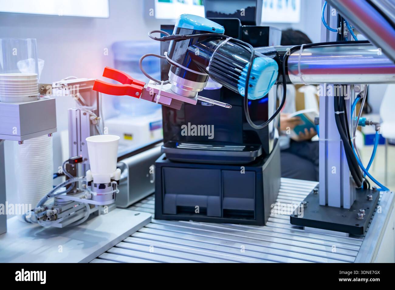 automatic arm preparing coffee in coffee machine Stock Photo