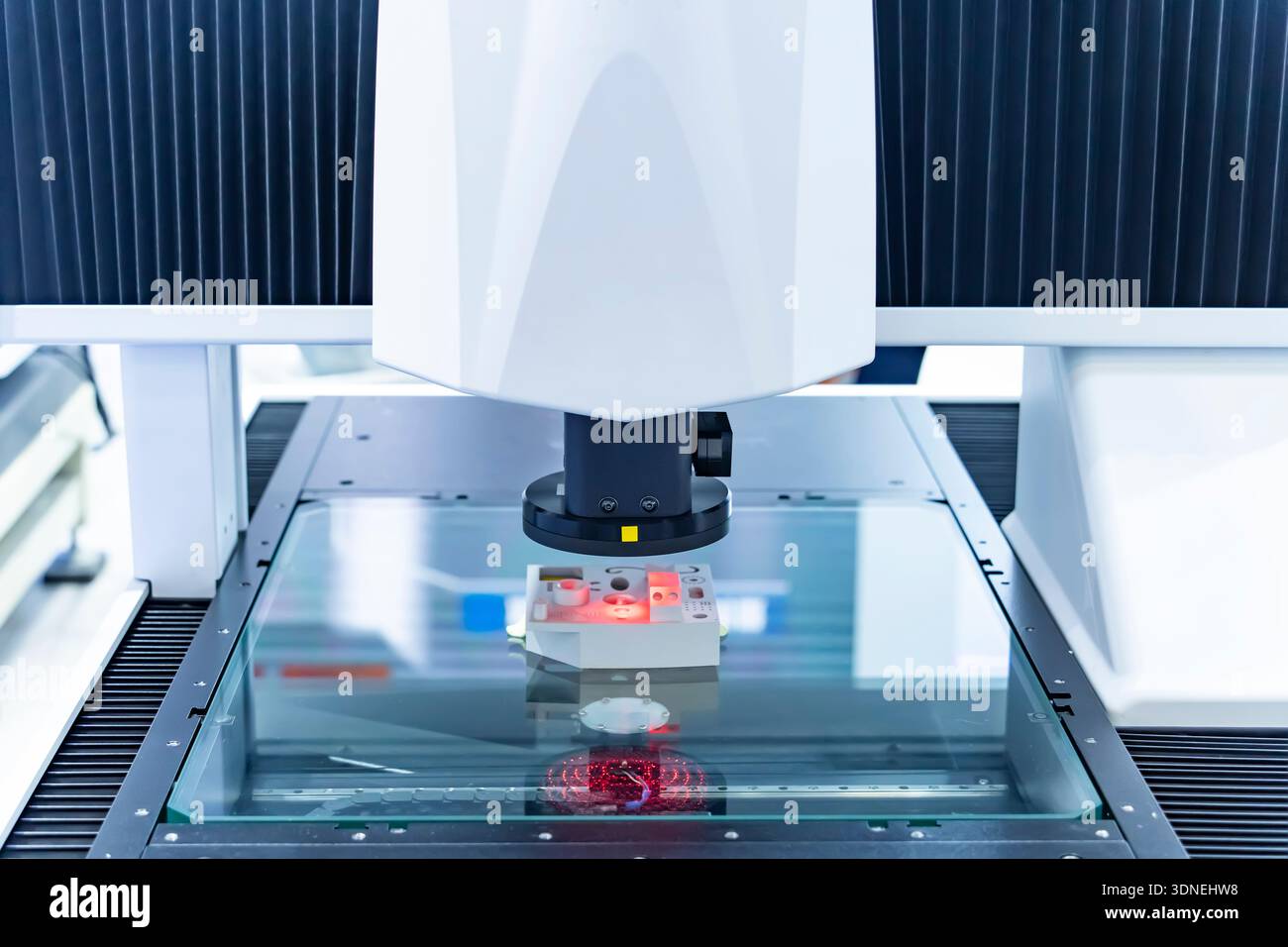 Vision measuring instrument inspecting PCB circuit board Stock Photo