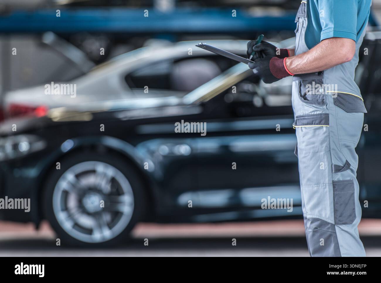 Auto mechanic stands near hi-res stock photography and images - Alamy