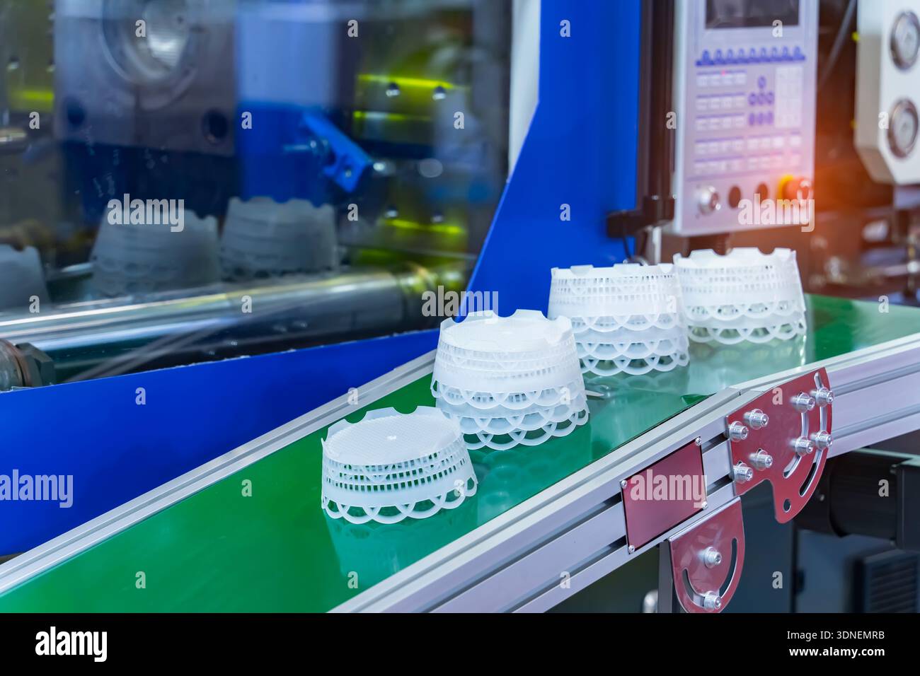 Stack of polypropylene containers on conveyor belt of automatic plastic ...