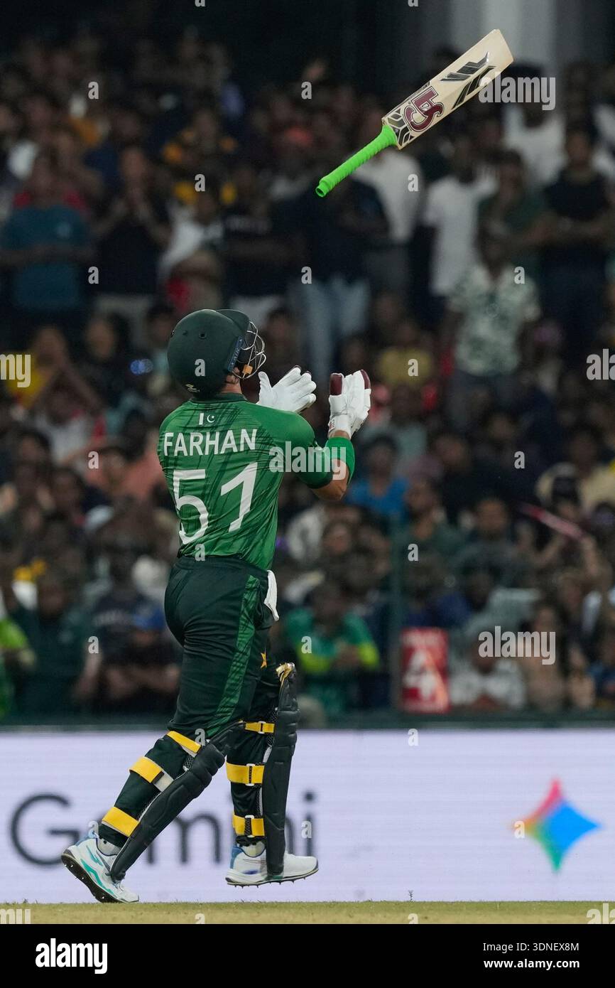 Pakistan's Sahibzada Farhan tosses his bat in the air after losing his ...