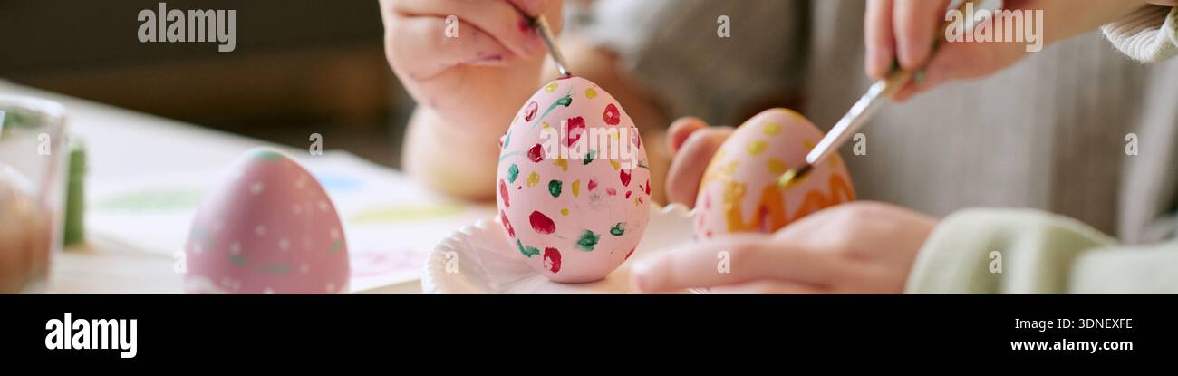 Header of Children Decorating Easter Eggs Together during Creative Activity Stock Photo