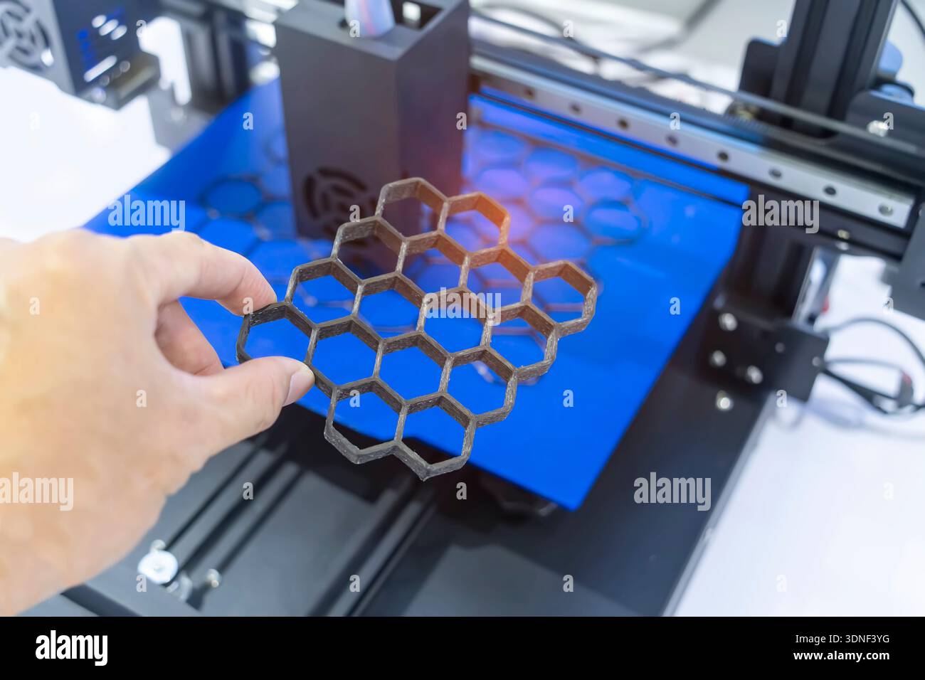 hand with Object printed on 3d printer close-up. Stock Photo