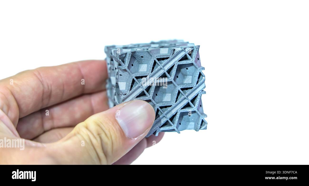 hand with metal object printed on 3d printer close-up Stock Photo