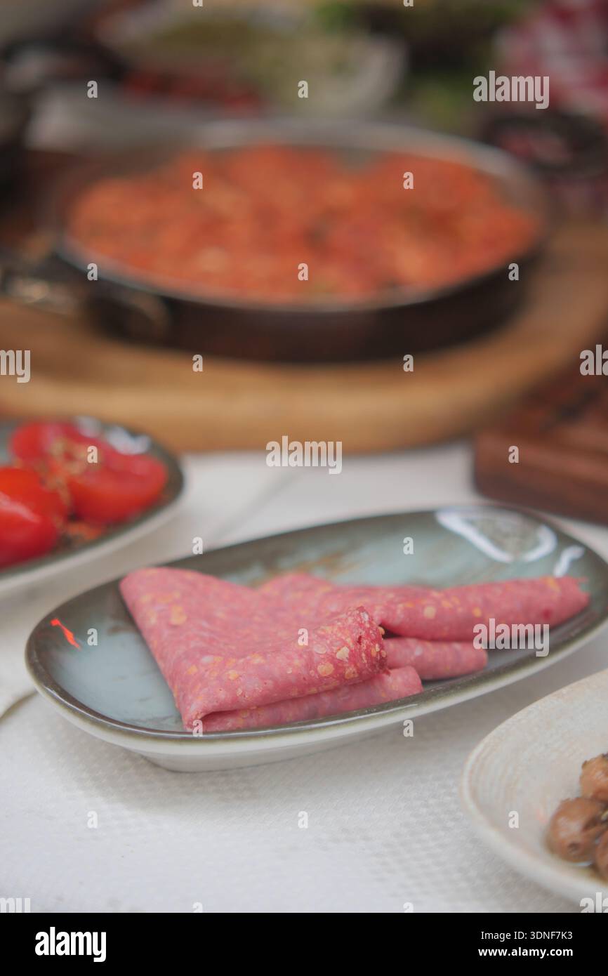Food preparation with various dishes in the kitchen setting Stock Photo