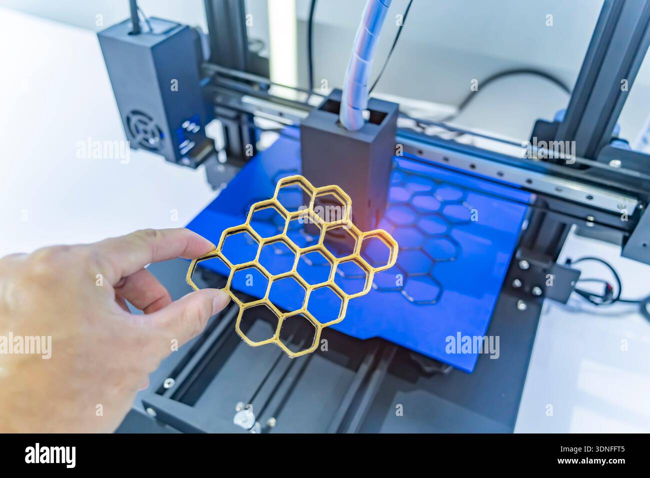 hand with Object printed on 3d printer close-up. Stock Photo
