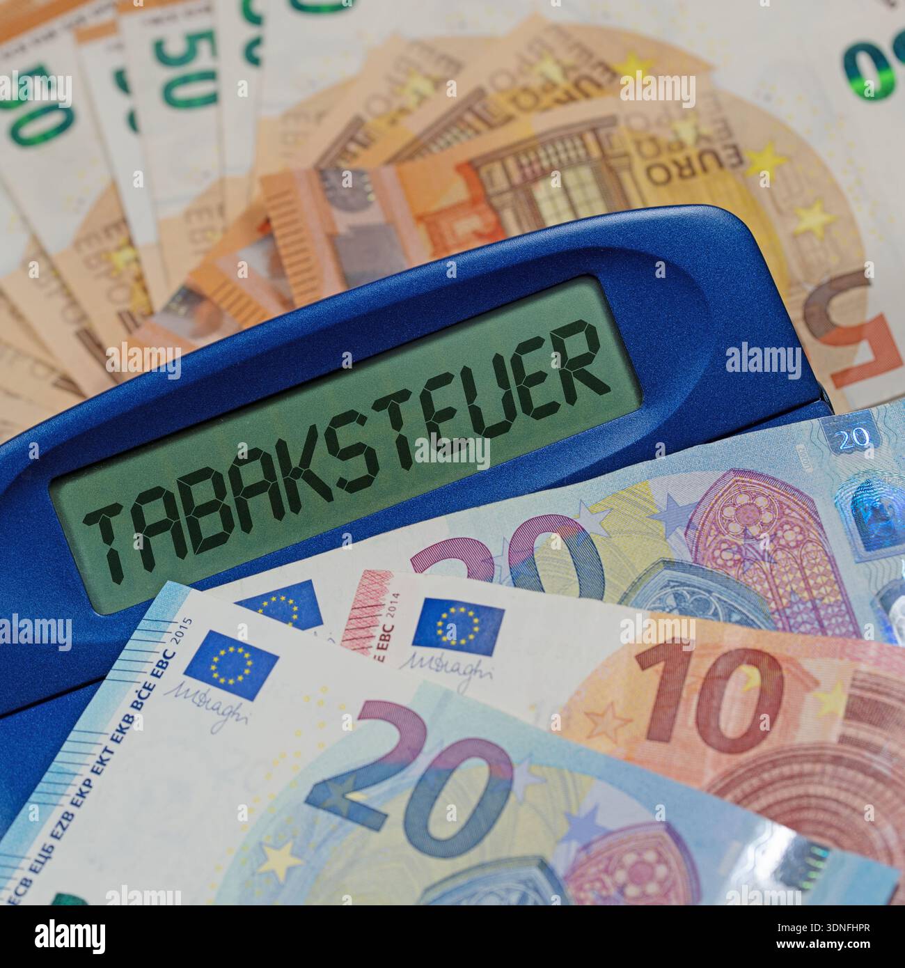 tobacco calculator Calculator with the inscription “Tobacco Tax” on the display Stock Photo