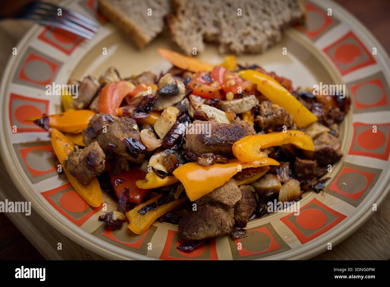 Beef Stir Fry with Bell Peppers on Plate Stock Photo