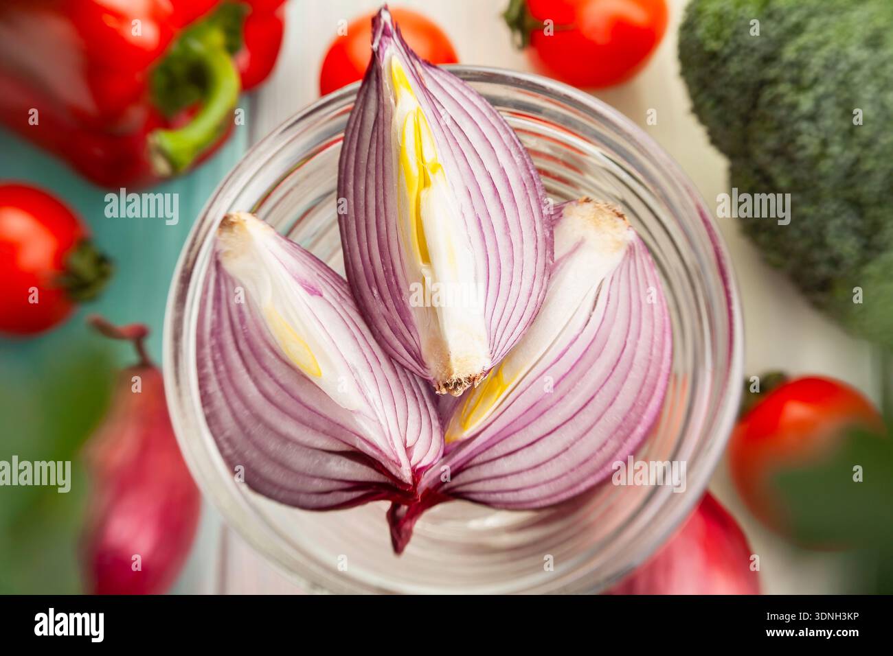 sliced red onion on wood background Stock Photo