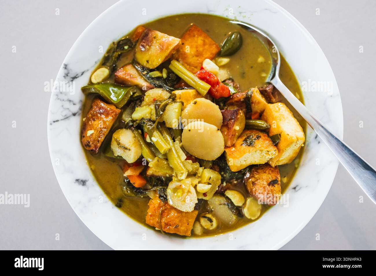 vegetarian green curry made with tofu and mixed vegetables in a creamy ...