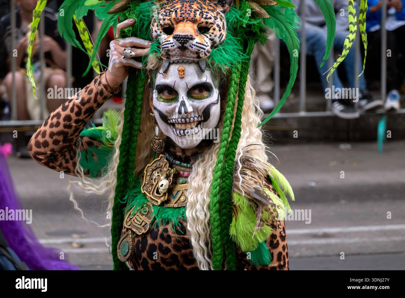 Portrait of woman in jaguar and human skull costume on Day of the Dead parade in Mexico City, Mexico Stock Photo