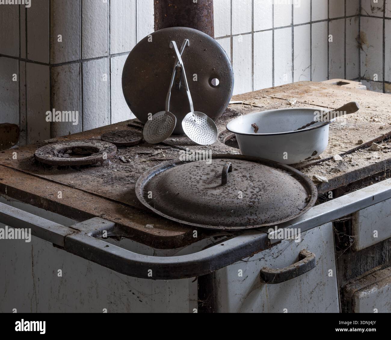 Rusted stove with kitchen appliances in the kitchen in an abandoned ...