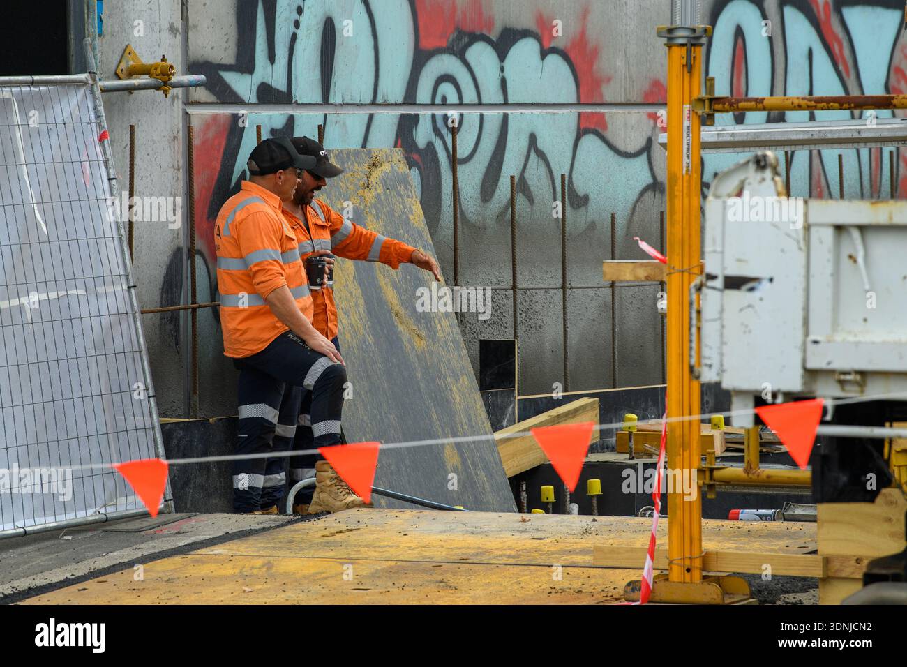 A construction workers look at an access ramp in Melbourne, Wednesday ...