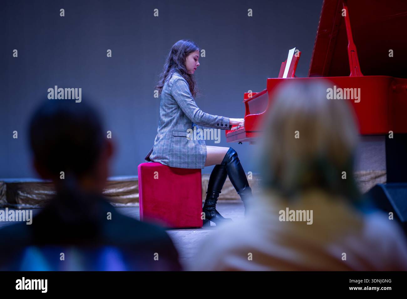 Woman in red dress plays the piano hi-res stock photography and images -  Alamy