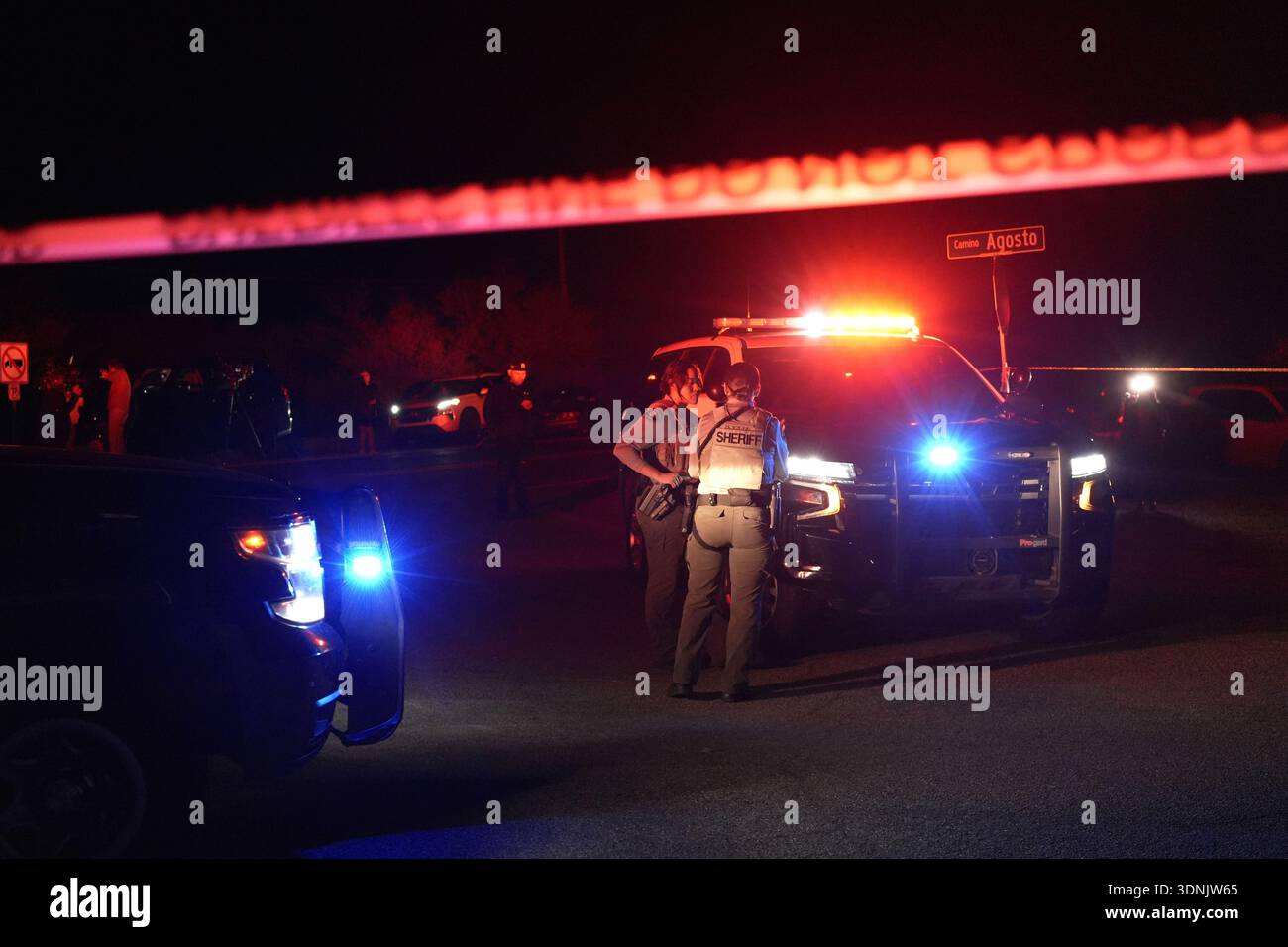 Sheriff Rico Detectives Sheriff's officials block the entrance to a road where a home was being ...