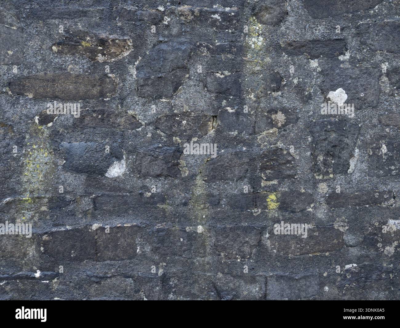 Historic Limestone with Natural Black Staining Stock Photo