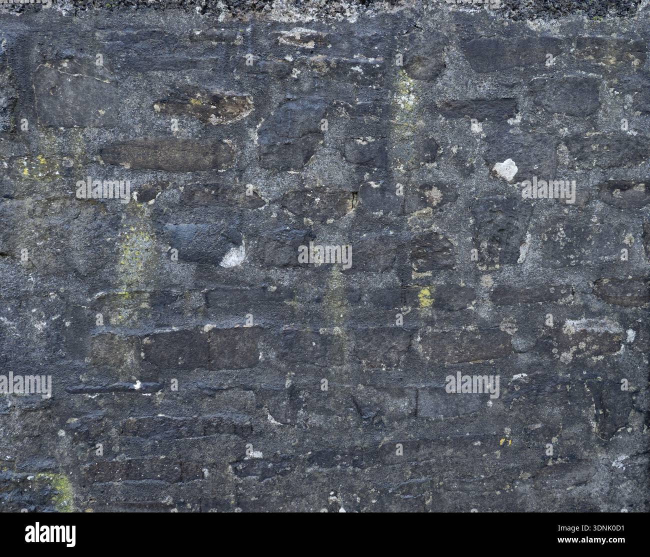 Historic Limestone with Natural Black Staining Stock Photo