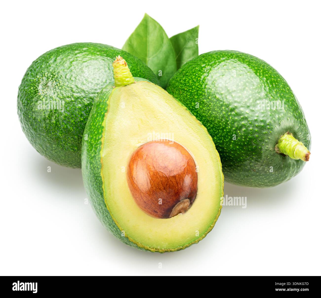 Whole green avocados and avocado half with pit inside on white ...