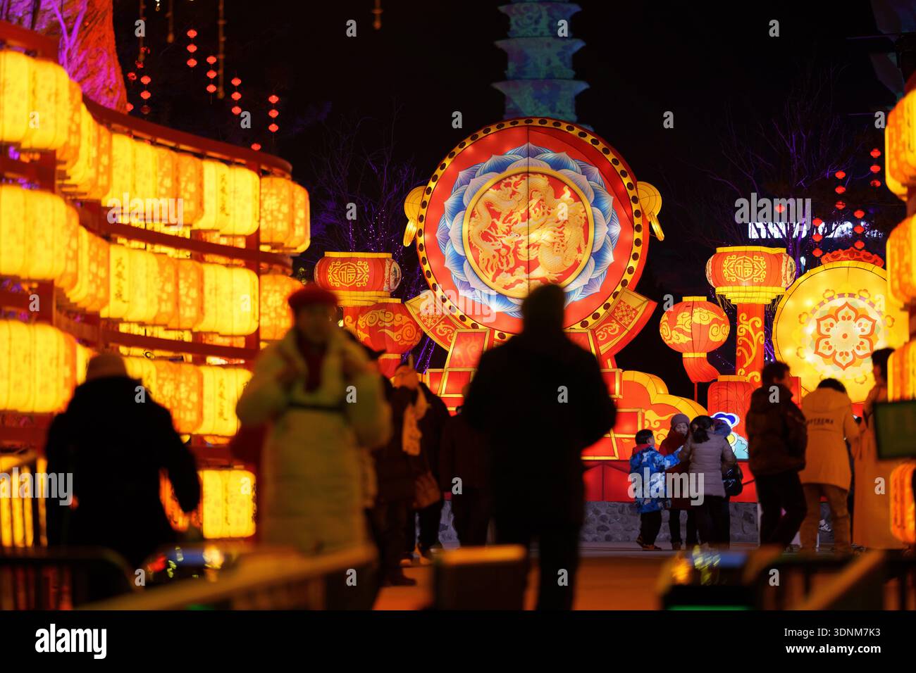 Visitors walk near illuminated lantern displays ahead of the Lunar New ...