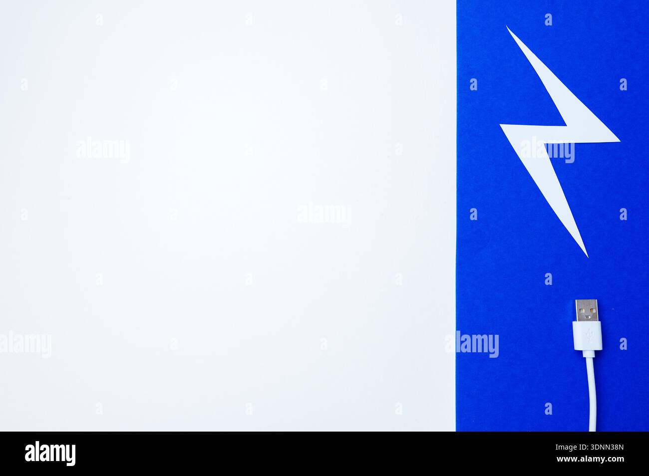 Clean Composition Showcasing USB Cable Near Stylized Lightning Shape On Vibrant Background Stock Photo