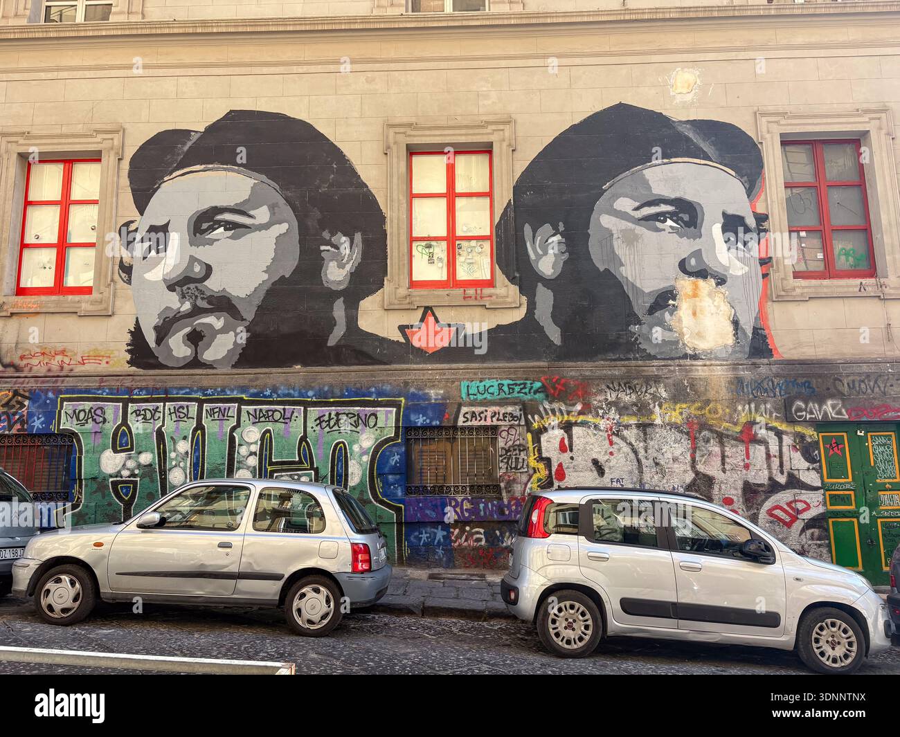 Diego Maradona mural, blowing bubble gum, on a building facade in ...