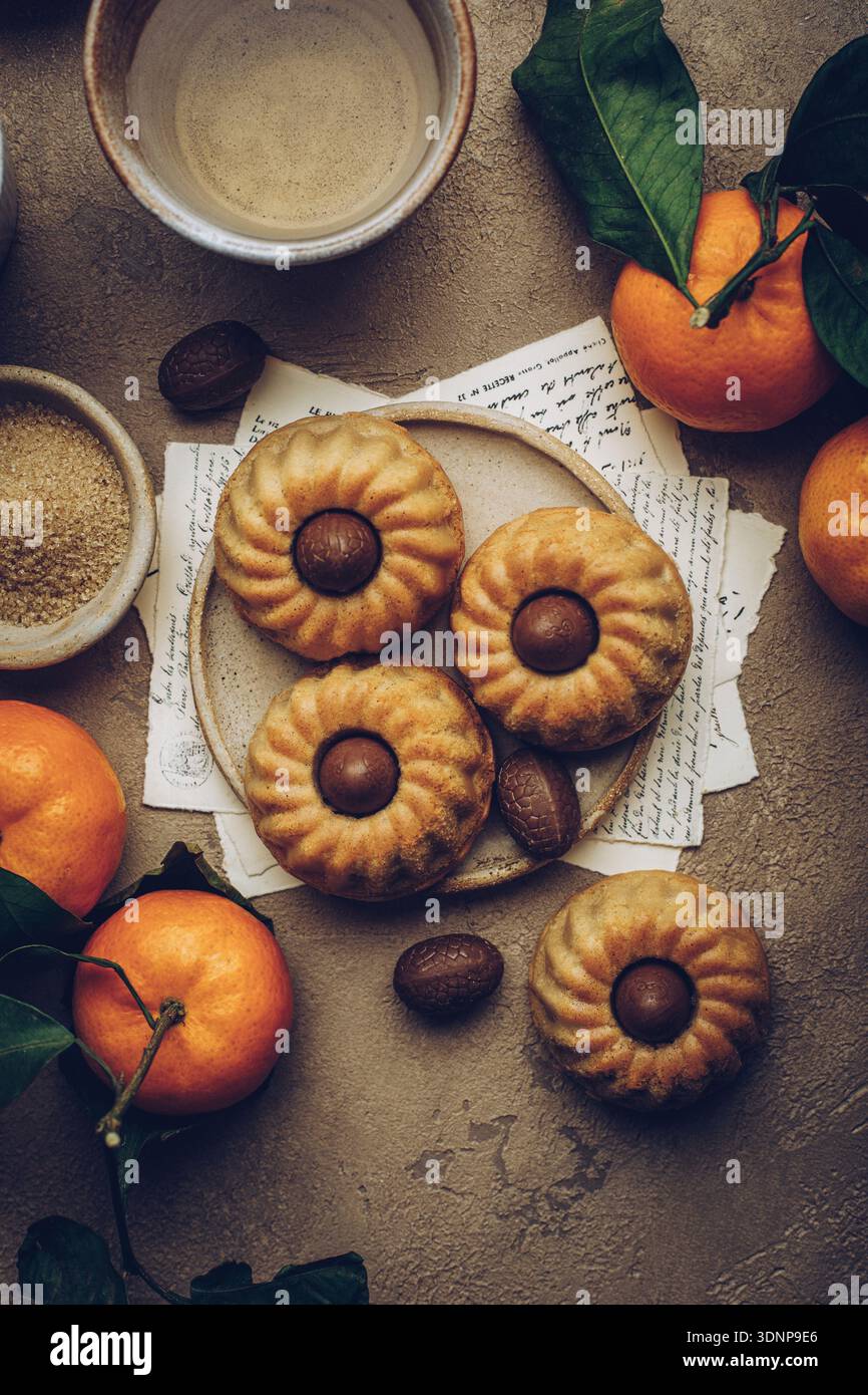 Mini bundt cakes with chocolate eggs Stock Photo