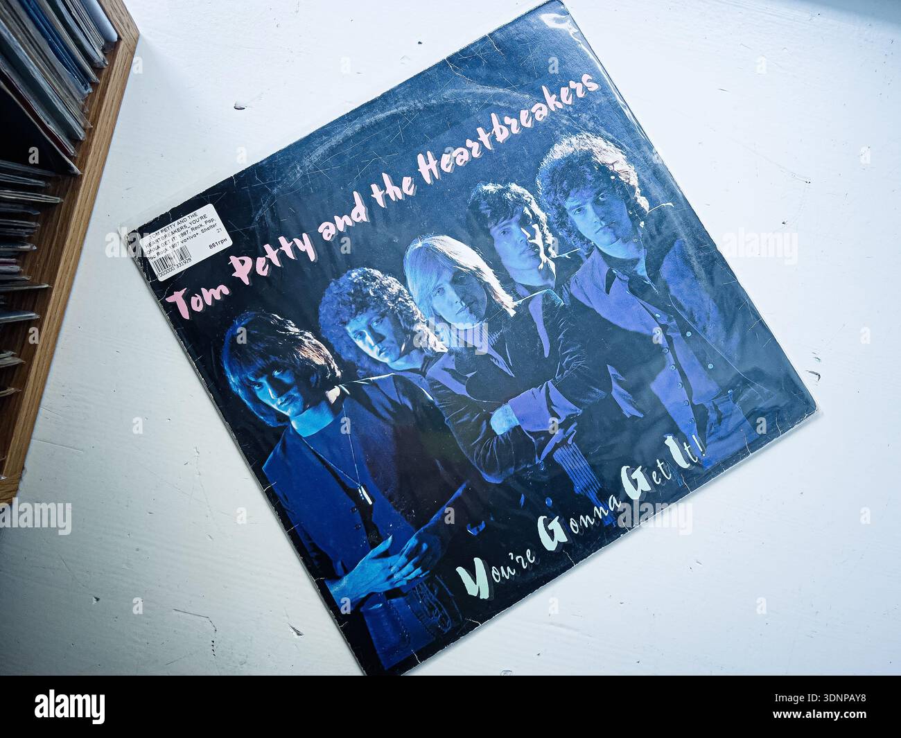 Lviv, Ukraine - February 07, 2026: Vinyl 1978 album You're Gonna Get It cover featuring Tom Petty and the Heartbreakers in a blue tinted portrait. Stock Photo
