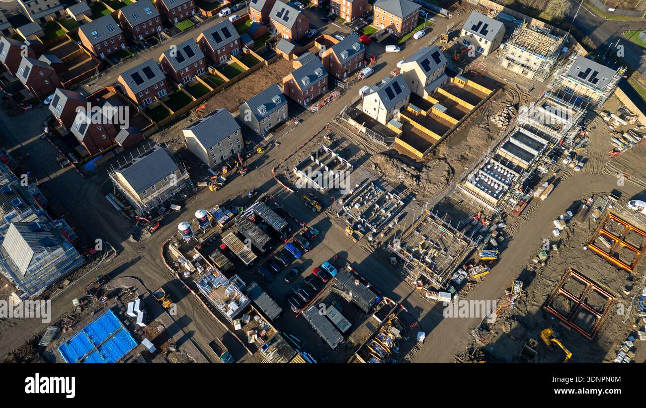 Aerial view of a housing development with completed homes and ongoing ...