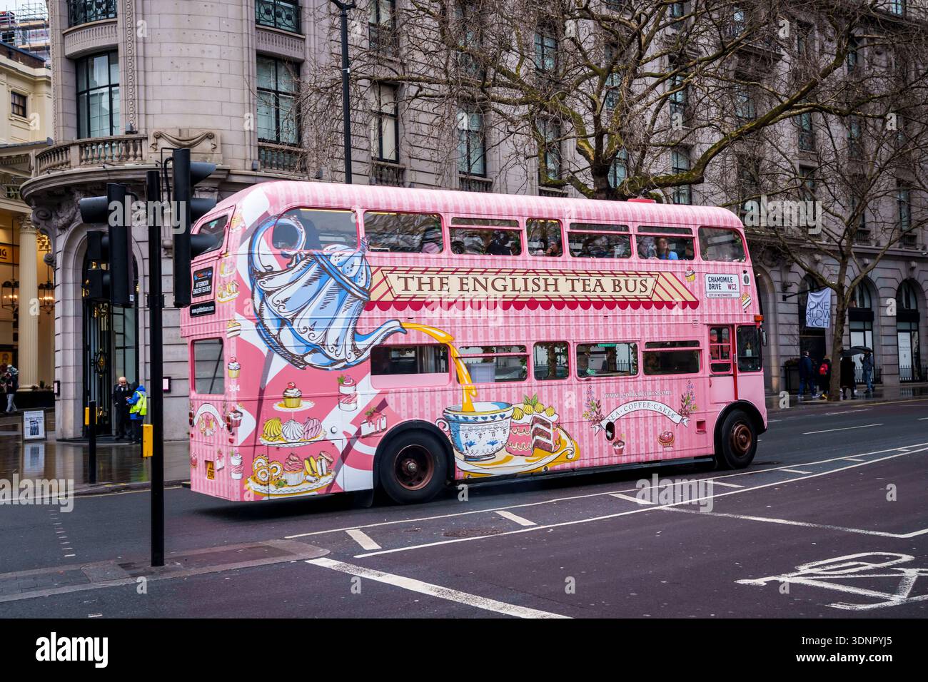 LONDON, UK. 15th  February 2025. Pink double decker buses in motion on a  street in central London. Stock Photo