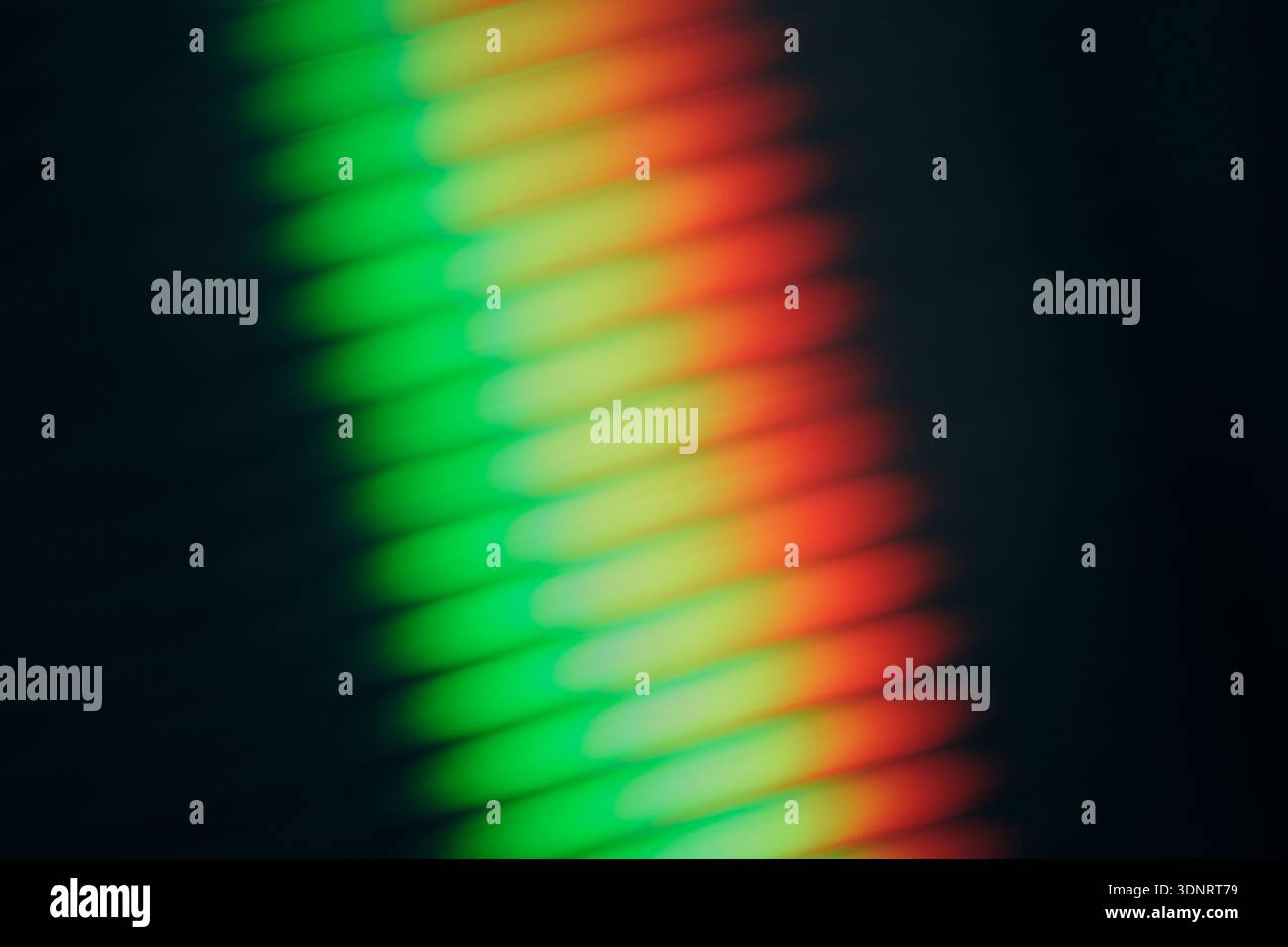 Abstract rainbow light refraction through ribbed glass, modern gradient background Stock Photo