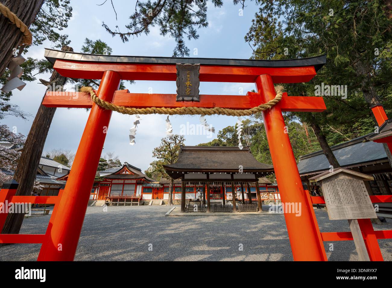 Entrance to the shrine with red torii gate, Kagura-den Hall, Yoshida ...
