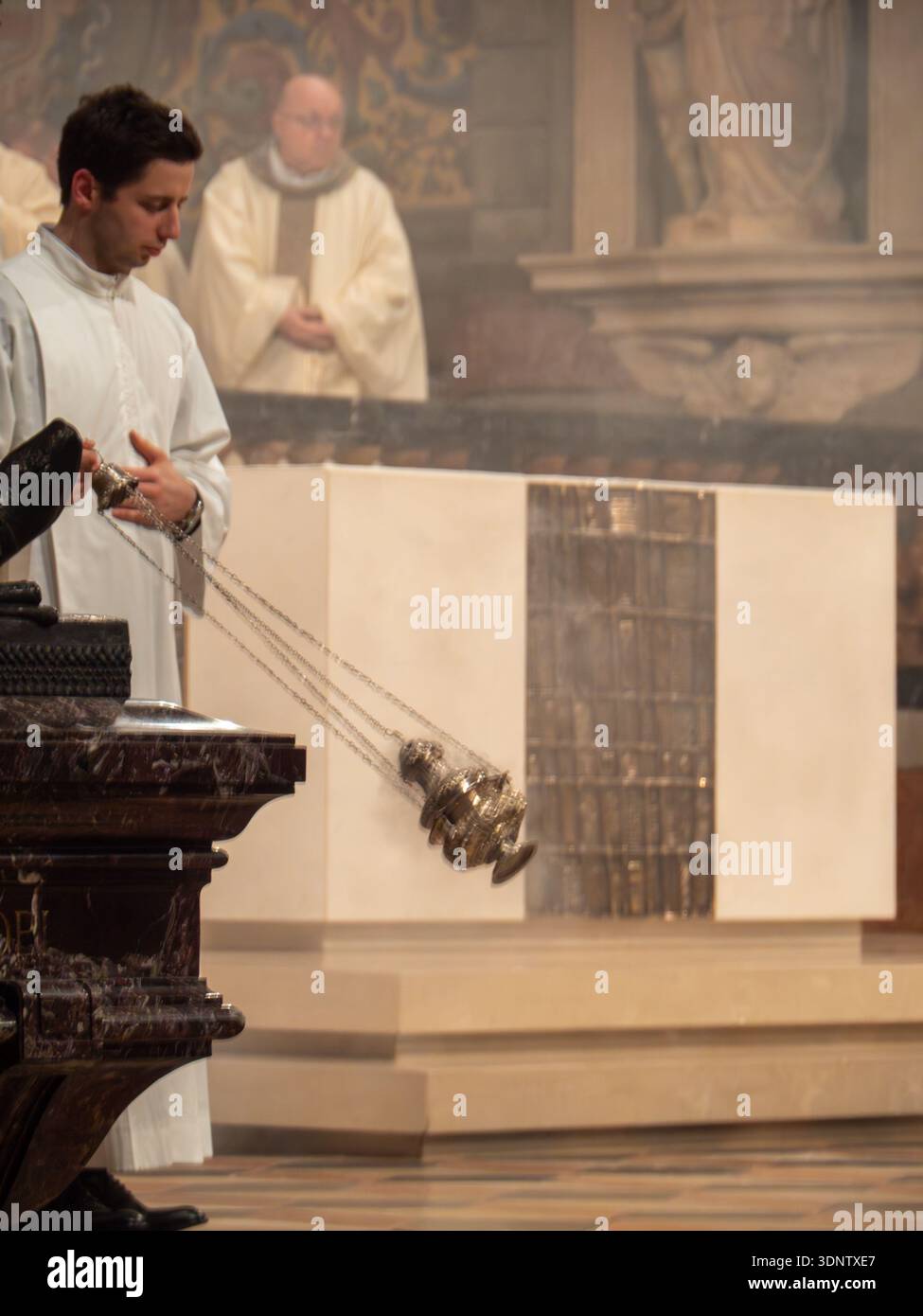 Cremona, Italy - February 2nd 2026 Priest swinging censer, releasing ...