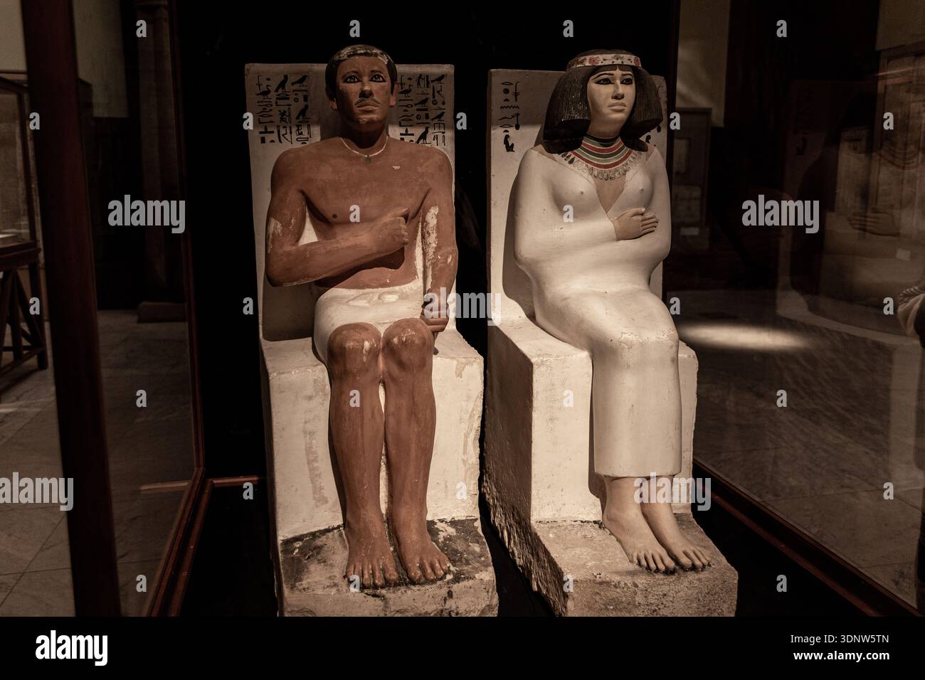 Painted limestone funerary statues of an ancient Egyptian married ...