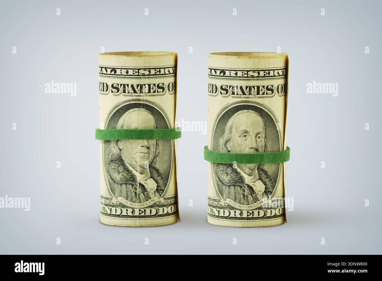 Dollar banknotes with green rubber bands covering eyes and mouth - Concept of money and illegality Stock Photo