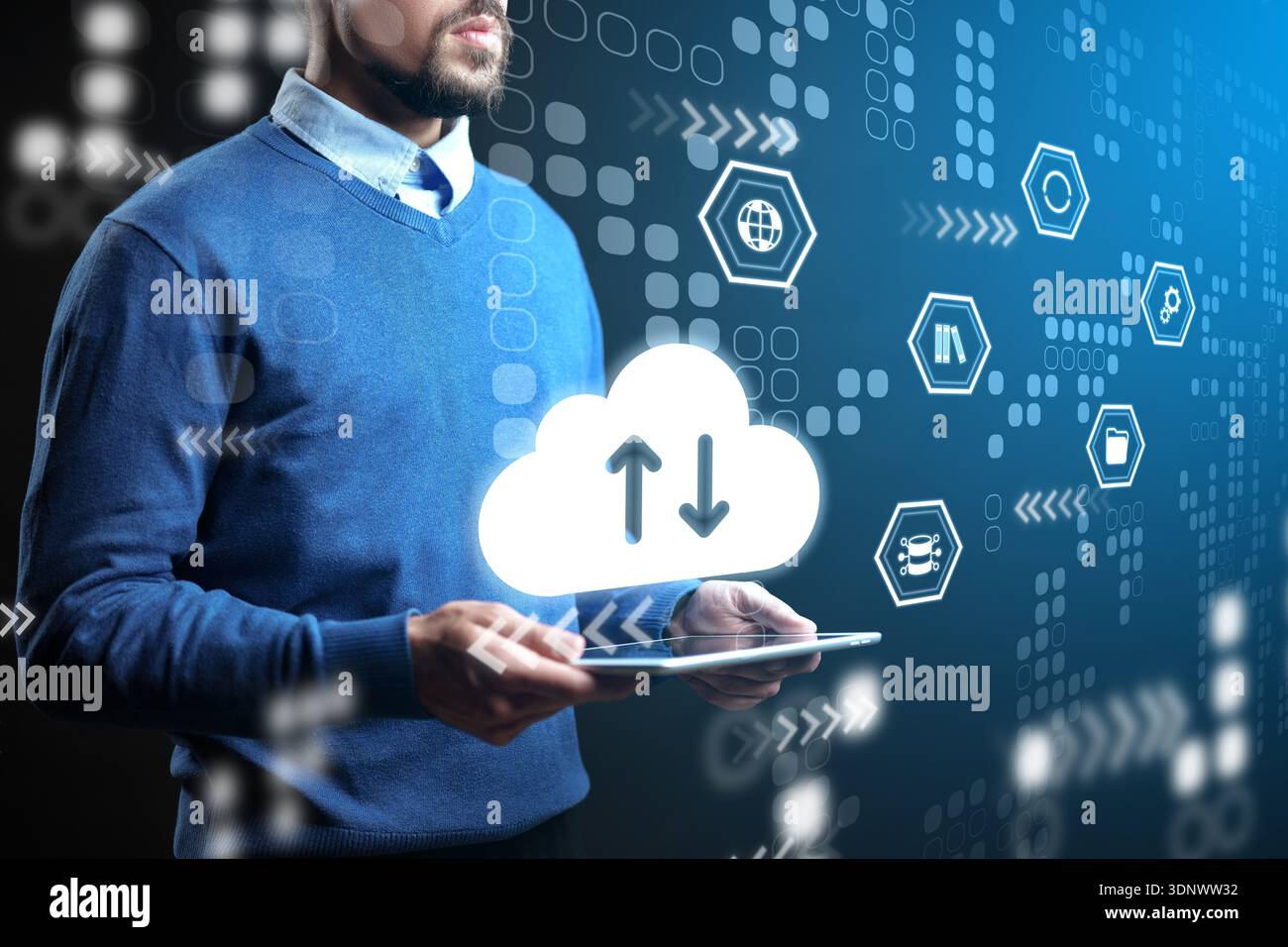 Man using tablet for cloud data exchange in digital environment with various icons Stock Photo