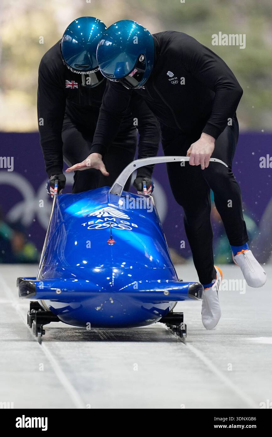 Britain's Brad Hall, right, starts for a two man bobsled training ...