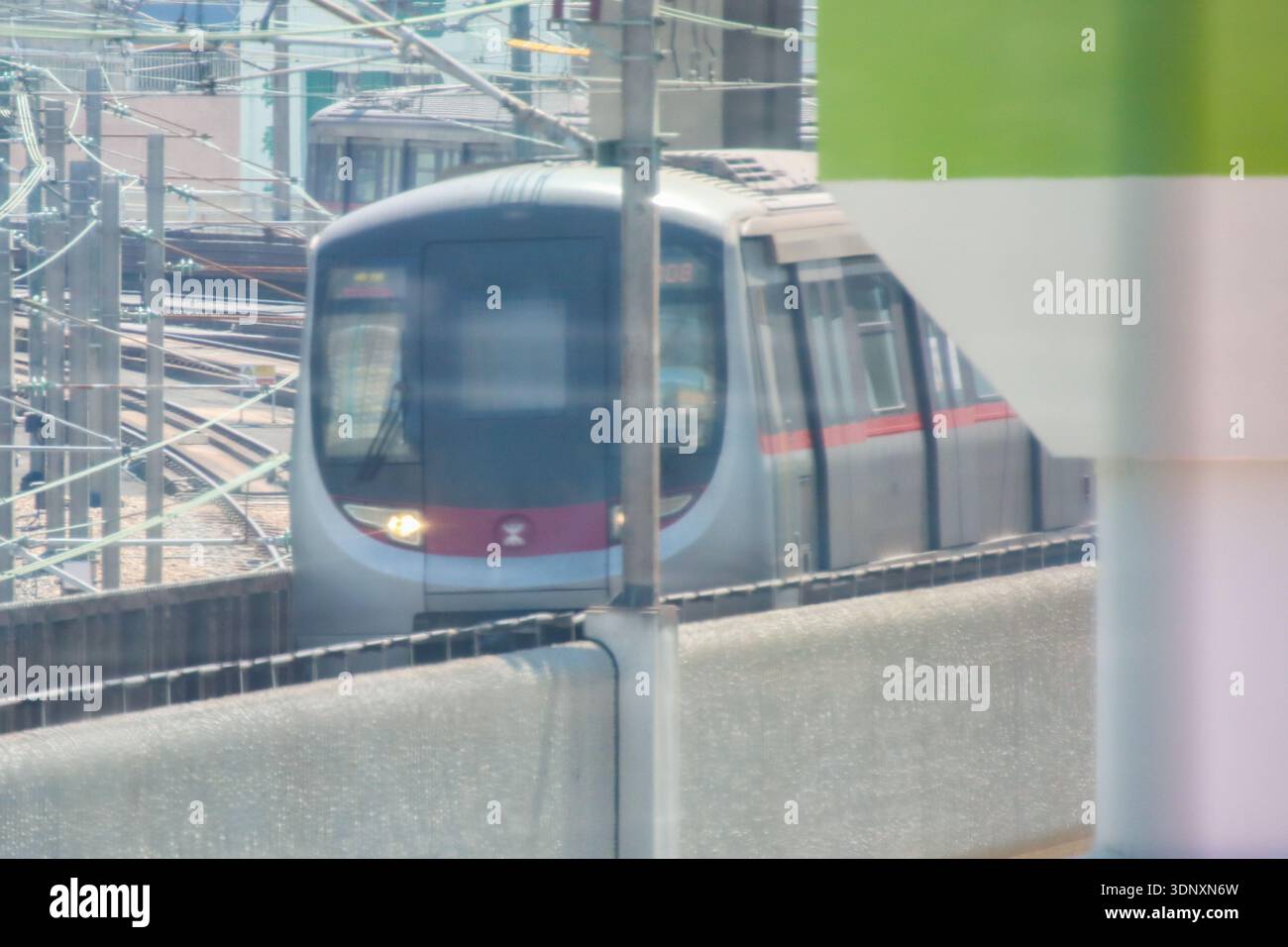 A Kwun Tong Line MTR Train Arriving At Kowloon Bay Station On February 