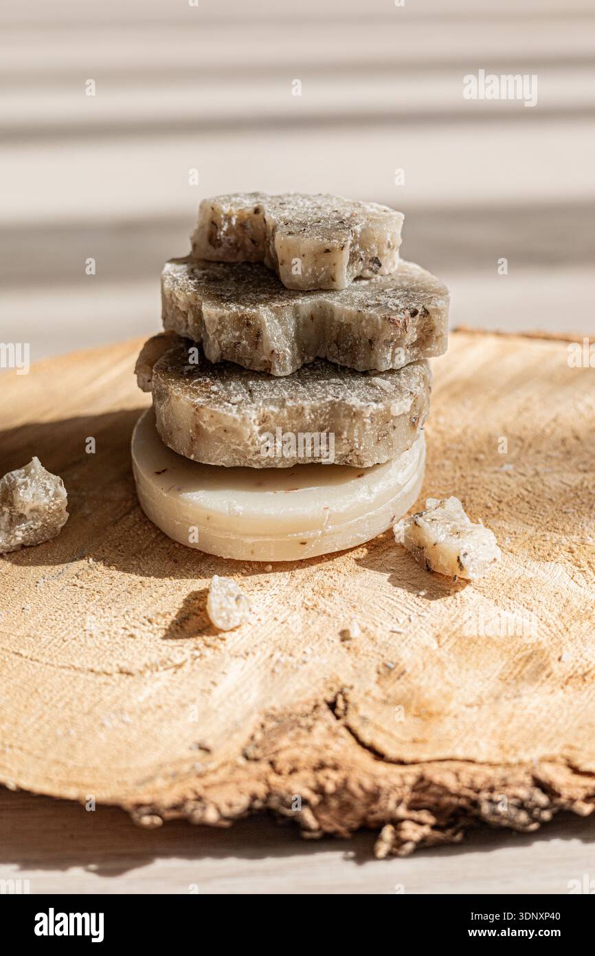 Natural Soap Stack A stack of handcrafted natural soaps in textured, organic shapes sits ...