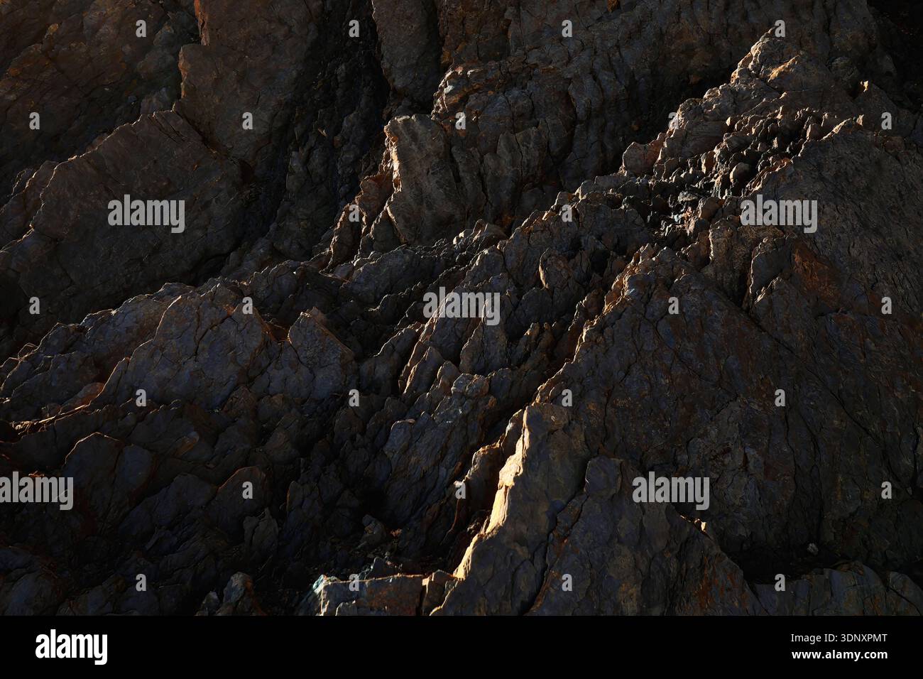 Prehistoric Jagged Rocks Jagged rock formations along an Asturias beach, showcasing complex ...