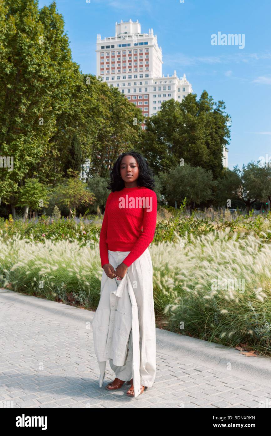 Tall young black woman standing hi-res stock photography and