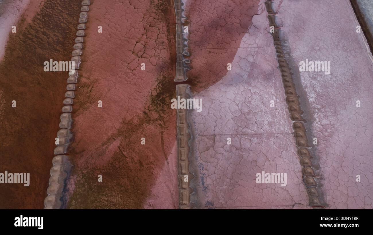 Linear Earth Aerial view of textured earth with deep red hues contrasting against ...