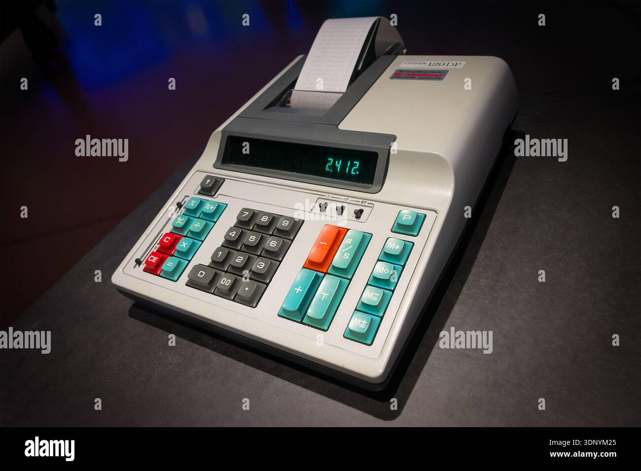 Close up of an old printing calculator displaying a number with a paper receipt feeding out of the top Stock Photo