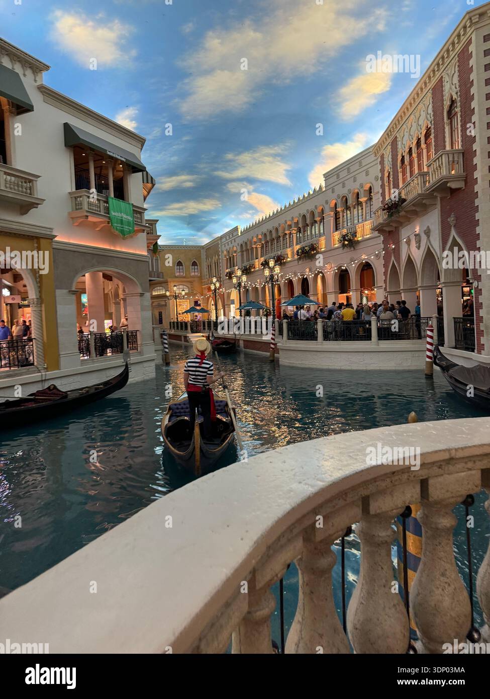 Gondola ride on the indoor canal at The Venetian Resort Las Vegas with gondolier and Venetian-style architecture, popular tourist attraction on the La - Smartphone Captured Stock Image