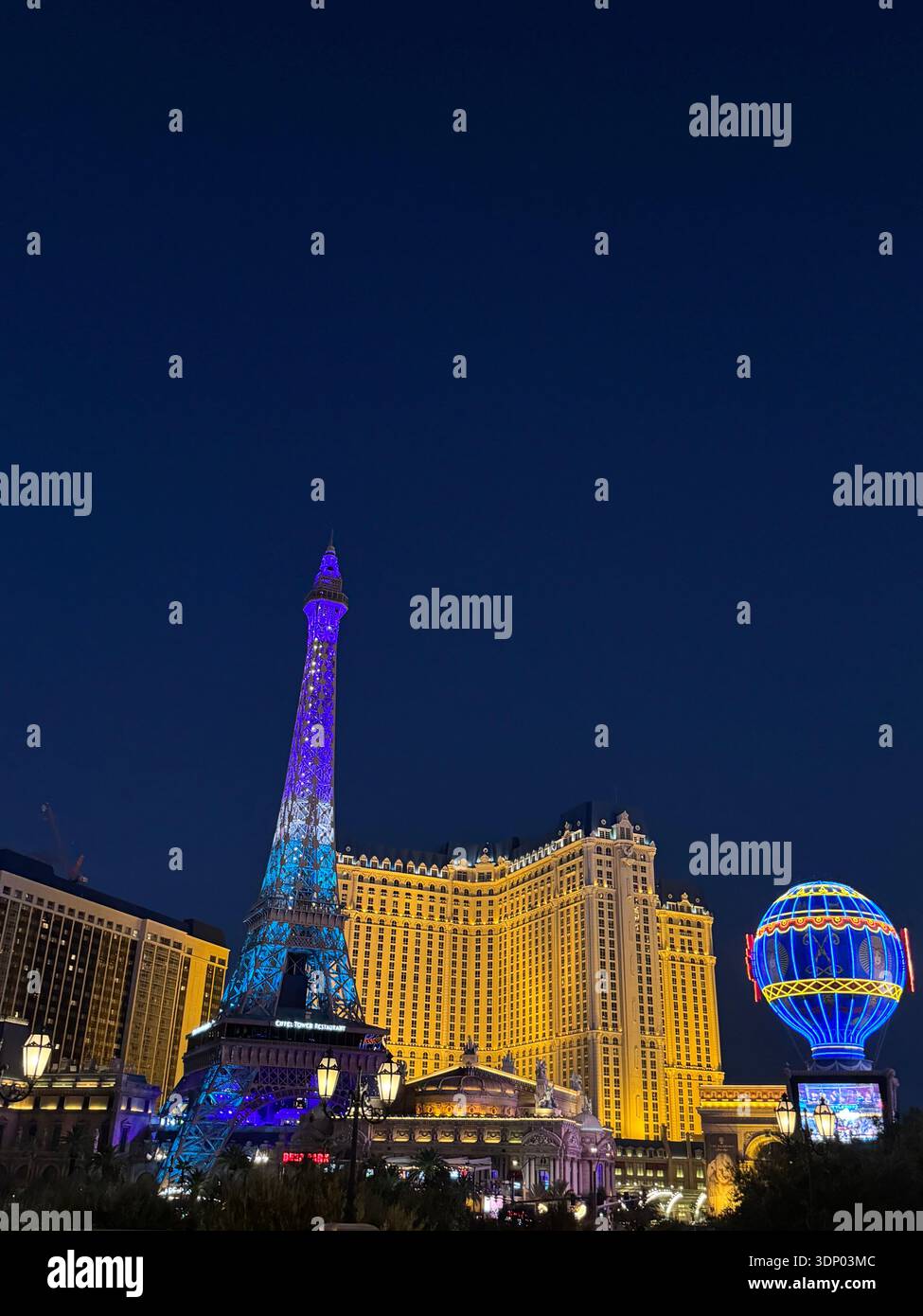 Paris Las Vegas Eiffel Tower replica illuminated at night on the Las Vegas Strip, Nevada, USA. - Smartphone Captured Stock Image