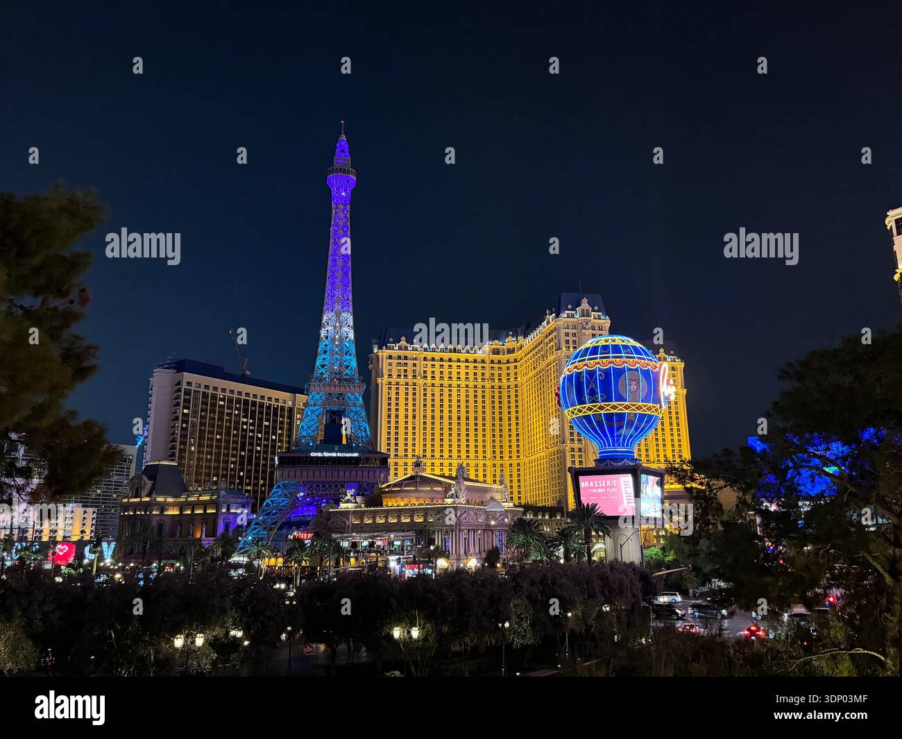 Paris Las Vegas Eiffel Tower replica illuminated at night on the Las Vegas Strip, Nevada, USA. - Smartphone Captured Stock Image