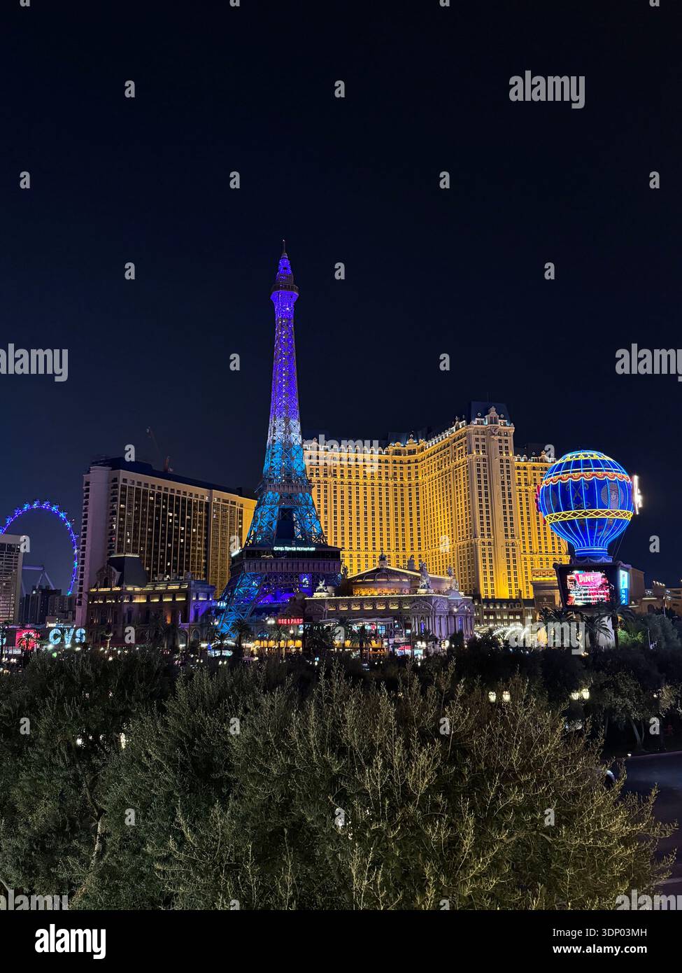 Paris Las Vegas Eiffel Tower replica illuminated at night on the Las Vegas Strip, Nevada, USA. - Smartphone Captured Stock Image