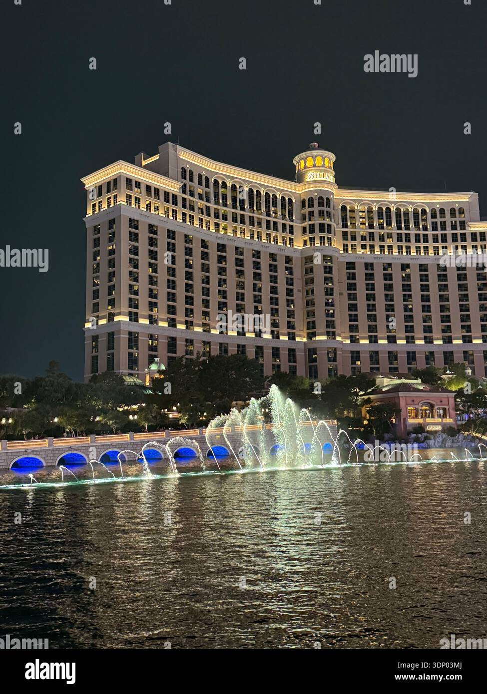 Bellagio Hotel and fountain lake illuminated at night on the Las Vegas Strip, Nevada, USA. - Smartphone Captured Stock Image