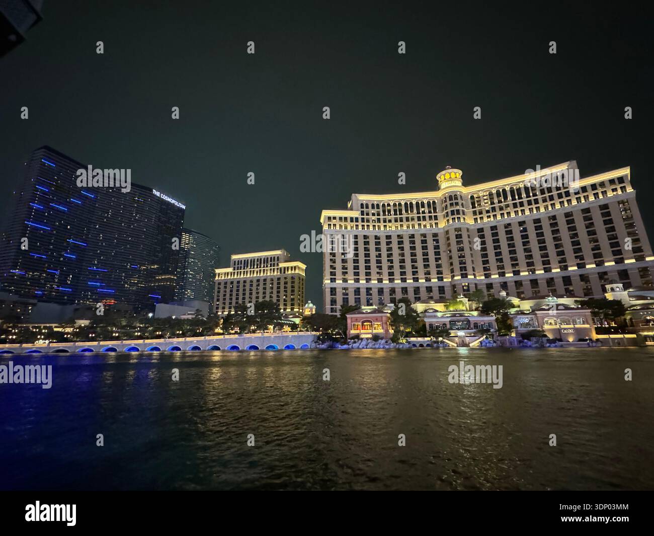 Bellagio Hotel and fountain lake illuminated at night on the Las Vegas Strip, Nevada, USA. - Smartphone Captured Stock Image